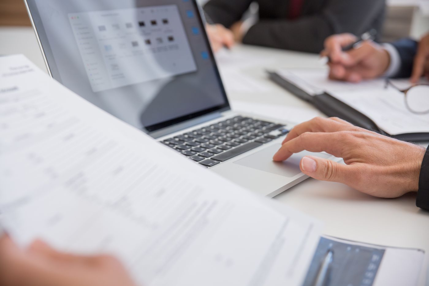 Business owner reviewing financial records on a laptop
